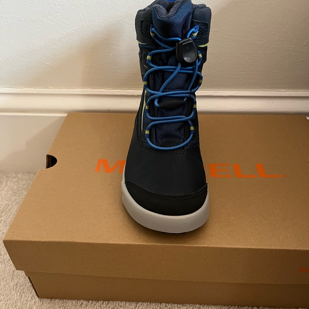 Snow boots for boys, waterproof and cozy. New , newer being worn.New with tags